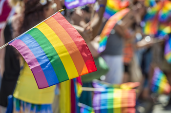 Rainbow pride flag waving at parade