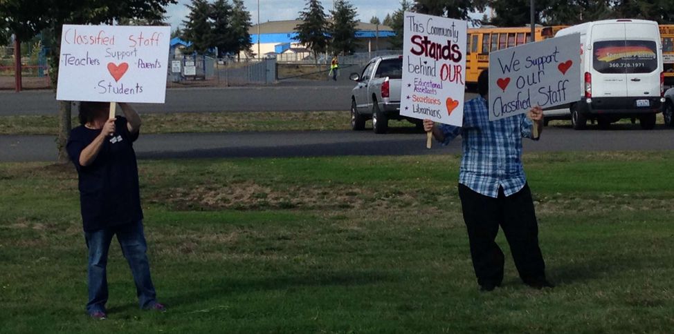 Picket signs: The community stands behind classified staff